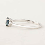 Side view of the Lena Ring featuring a 0.65ct blue Montana Sapphire set in recycled 14k white gold band
