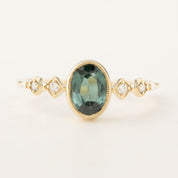 14k yellow gold ring with 1.02ct green tourmaline and white accent diamonds in bezel setting