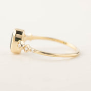 14k yellow gold Celeste ring with 1.02ct green tourmaline and white accent diamonds in bezel setting
