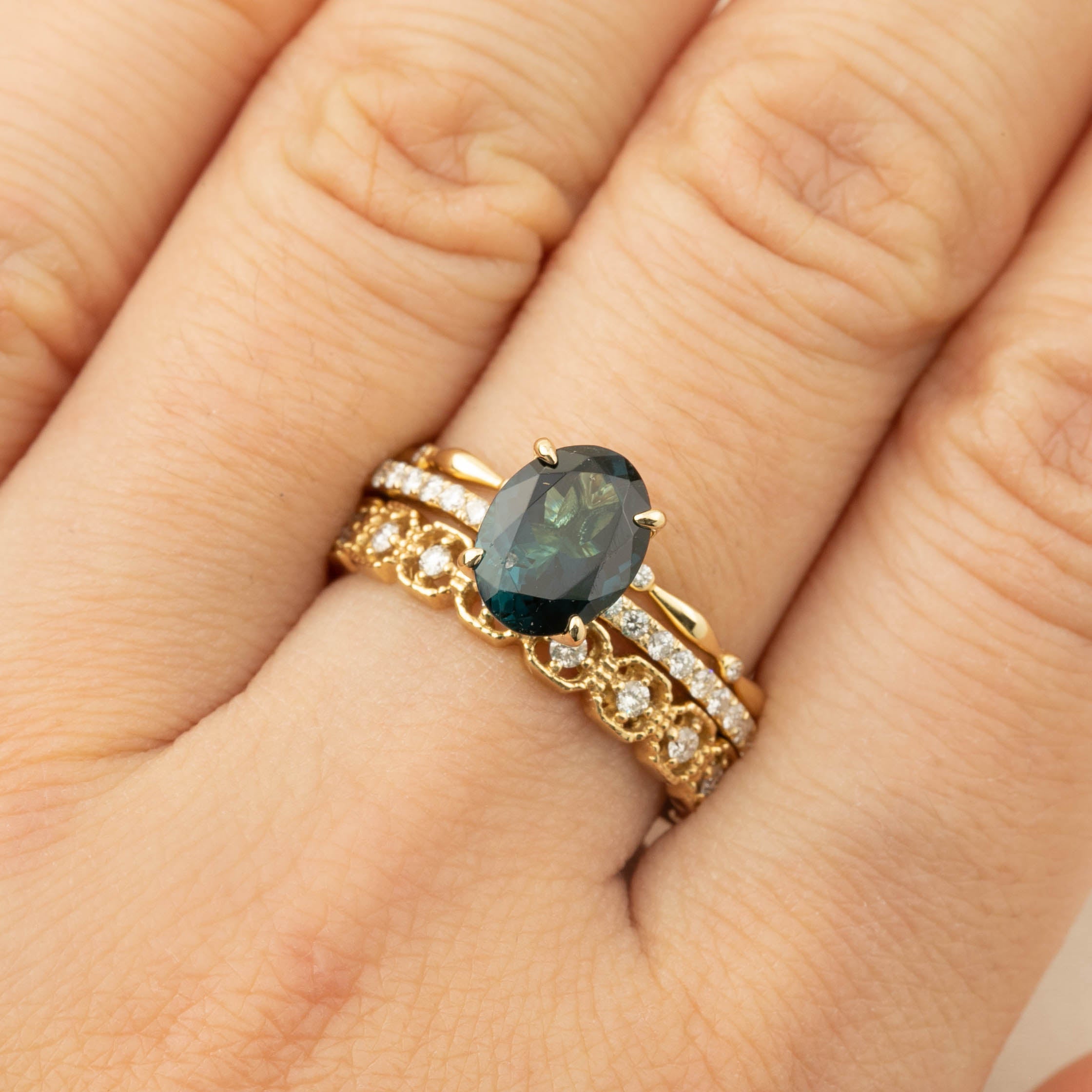 Elegant gold ring featuring a 1.64ct green tourmaline with diamond accents on a recycled 14k yellow gold band