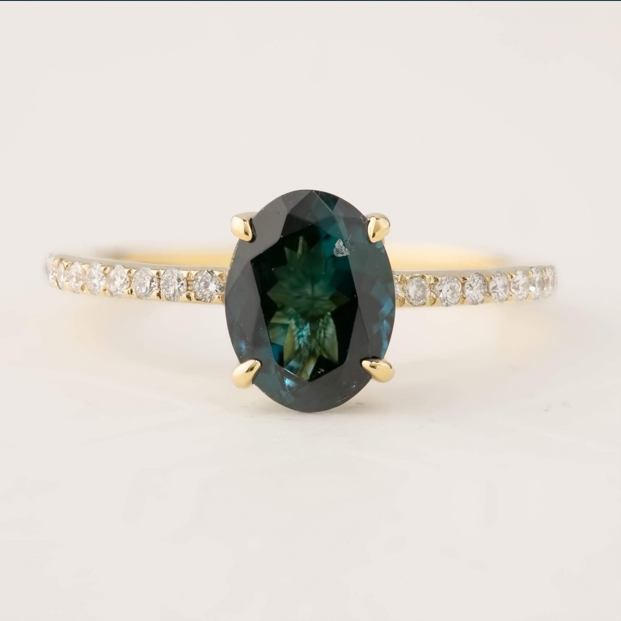 14k yellow gold ring with 1.64ct green tourmaline center stone and diamond pave band detailing