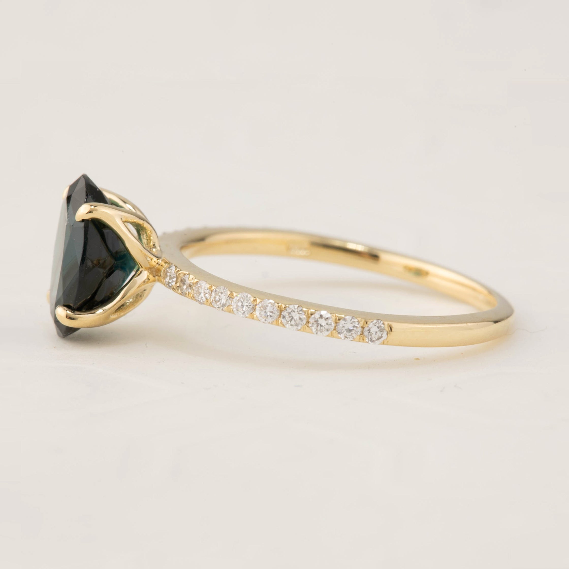 Side view of Maria Ring featuring 1.64ct green tourmaline and diamond pavé on 14k yellow gold band