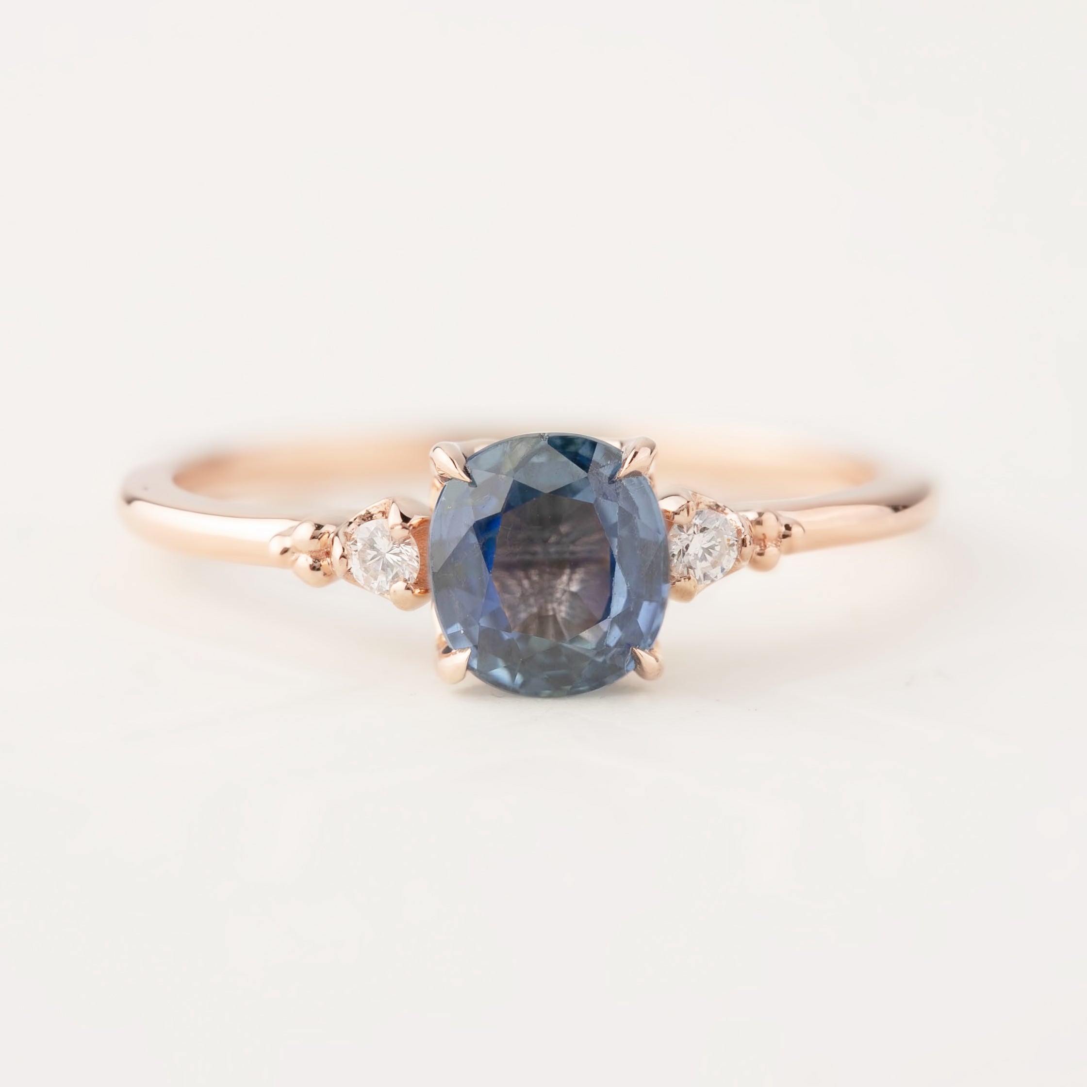 Estel ring featuring 1.24ct blue sapphire and diamond accents set in 14k rose gold band size 7, resizable 4-8.5