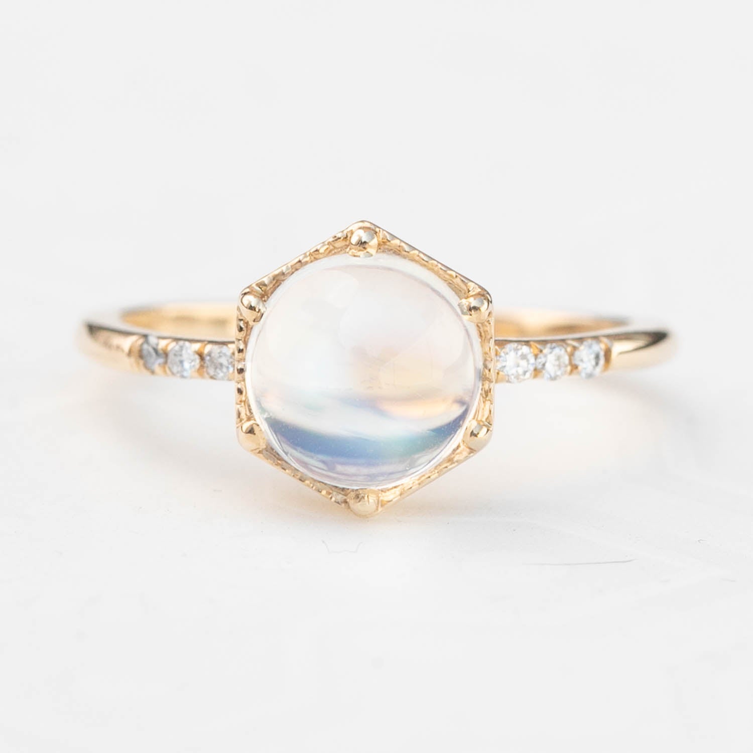 14k yellow gold Grace Ring with 1.8ct rainbow moonstone and small white accent diamonds on band