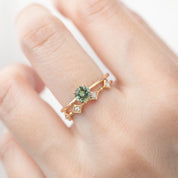 Hand wearing Star Diamond Eternity Ring with natural white diamonds and ethically sourced solid gold