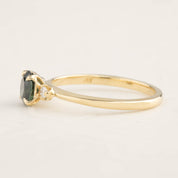 14k yellow gold ring with 0.85ct green Queensland peacock sapphire and small white accent diamonds side view