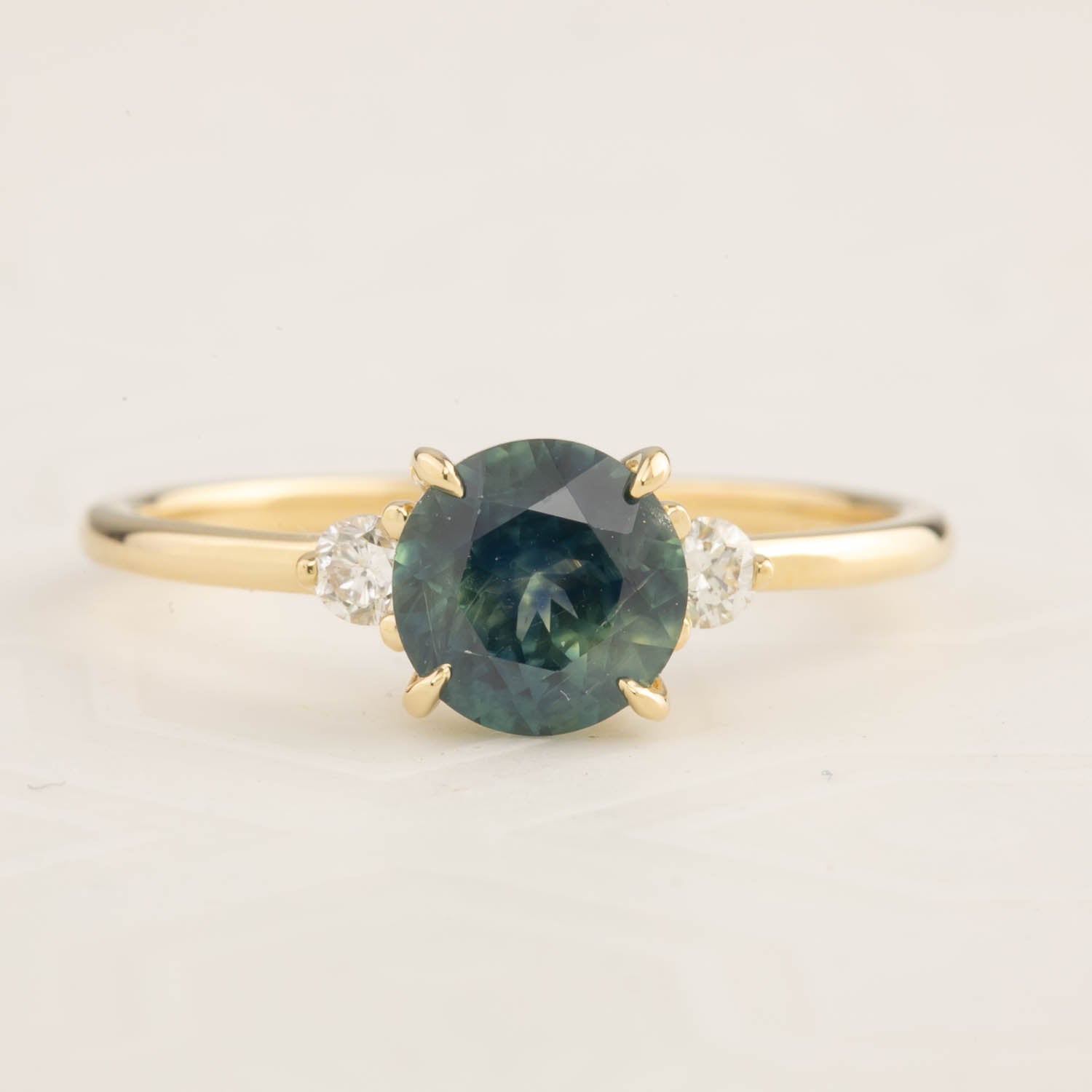 14k gold Emilie ring with 1.31ct blue-green Montana sapphire and diamond accents, size 7, low profile setting