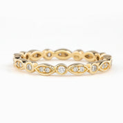 Gold Seren Ring with natural white diamonds in marquise and round settings, elegant and ethically sourced design