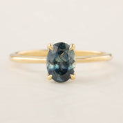 Sara Ring featuring 1.32ct blue Montana sapphire set in 14k yellow gold with a delicate straight band design