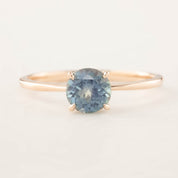 Nina Ring featuring a 1.12ct parti blue Montana sapphire set in 14k rose gold, handmade and ethically sourced by Envero Jewelry.