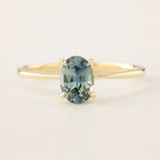Close-up of a one-of-a-kind Nina Ring with 0.98ct green Montana sapphire set in 14k yellow gold band