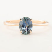 14k rose gold ring with 1.22ct teal blue Montana sapphire in a classic four-prong setting, size 7 adjustable band