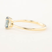 Side view of Nina Ring with 0.98ct blue Montana sapphire set in recycled 14k rose gold tapered band