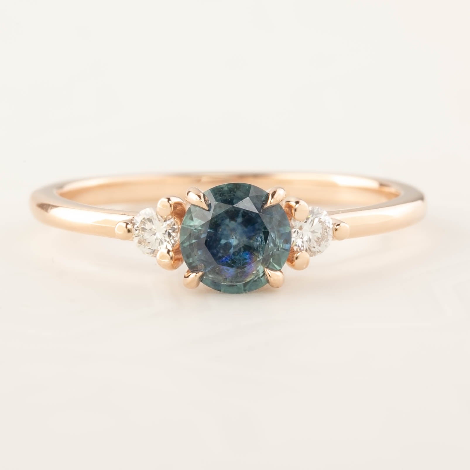 Emilie Ring featuring 0.66ct blue-green Montana sapphire with diamonds in 14k rose gold, handmade and one of a kind