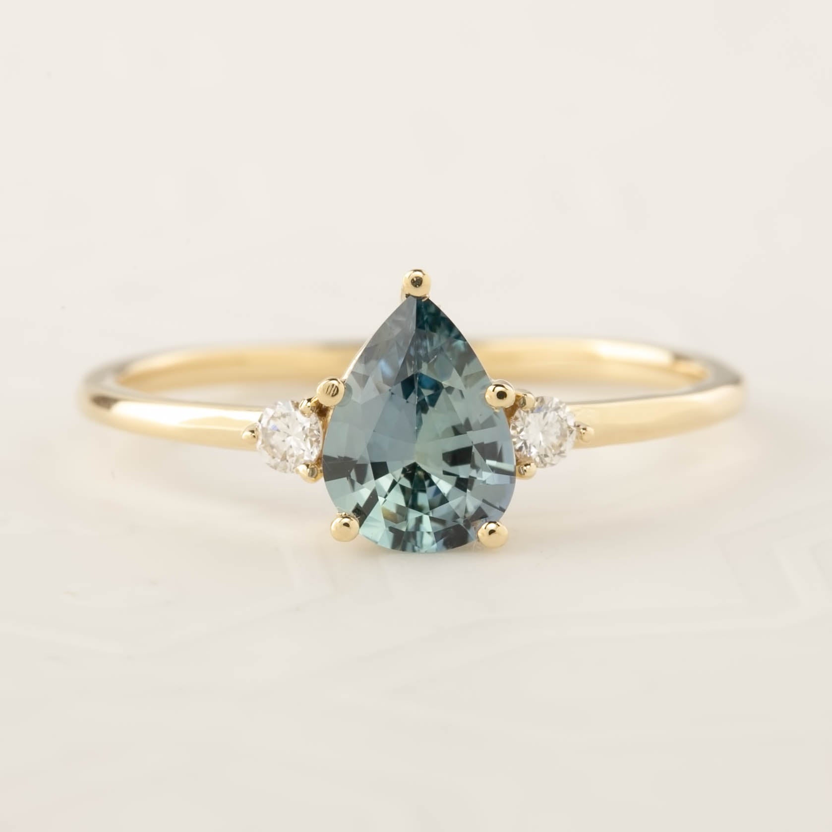 Emilie Ring with 0.84ct pear cut blue Montana sapphire, handmade in recycled 14k yellow gold, ethically sourced gems