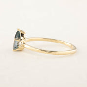 Emilie Ring featuring a 0.84ct pear cut Blue Montana Sapphire in recycled 14k yellow gold, handmade and one of a kind.