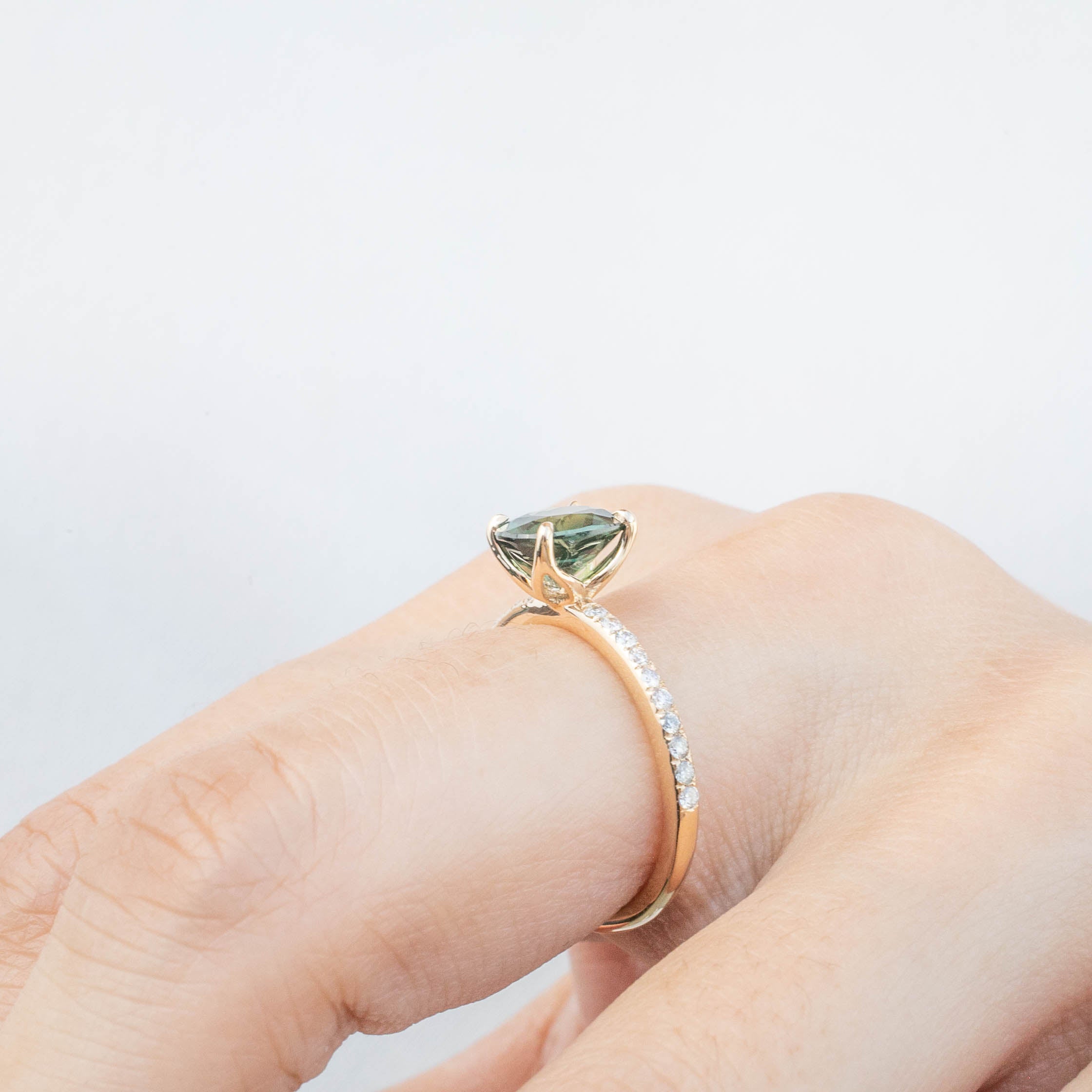 Maria Ring 1.65ct Peacock Green Sri Lankan Sapphire in 14k yellow gold with authentic diamonds on hand