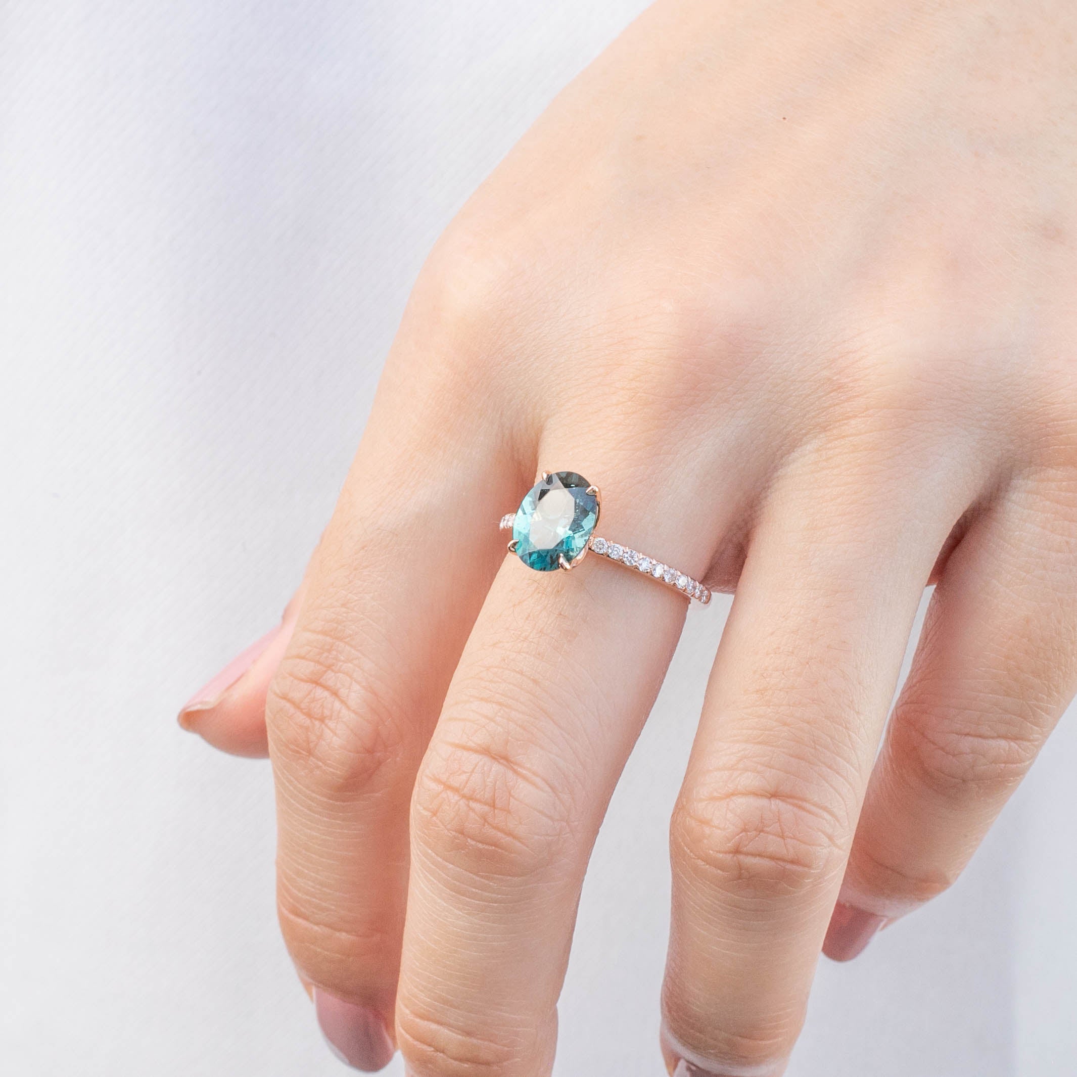 Maria Ring featuring a 1.8ct Namibian Green Tourmaline set in 14k rose gold with white diamond accents, handmade and authentic.
