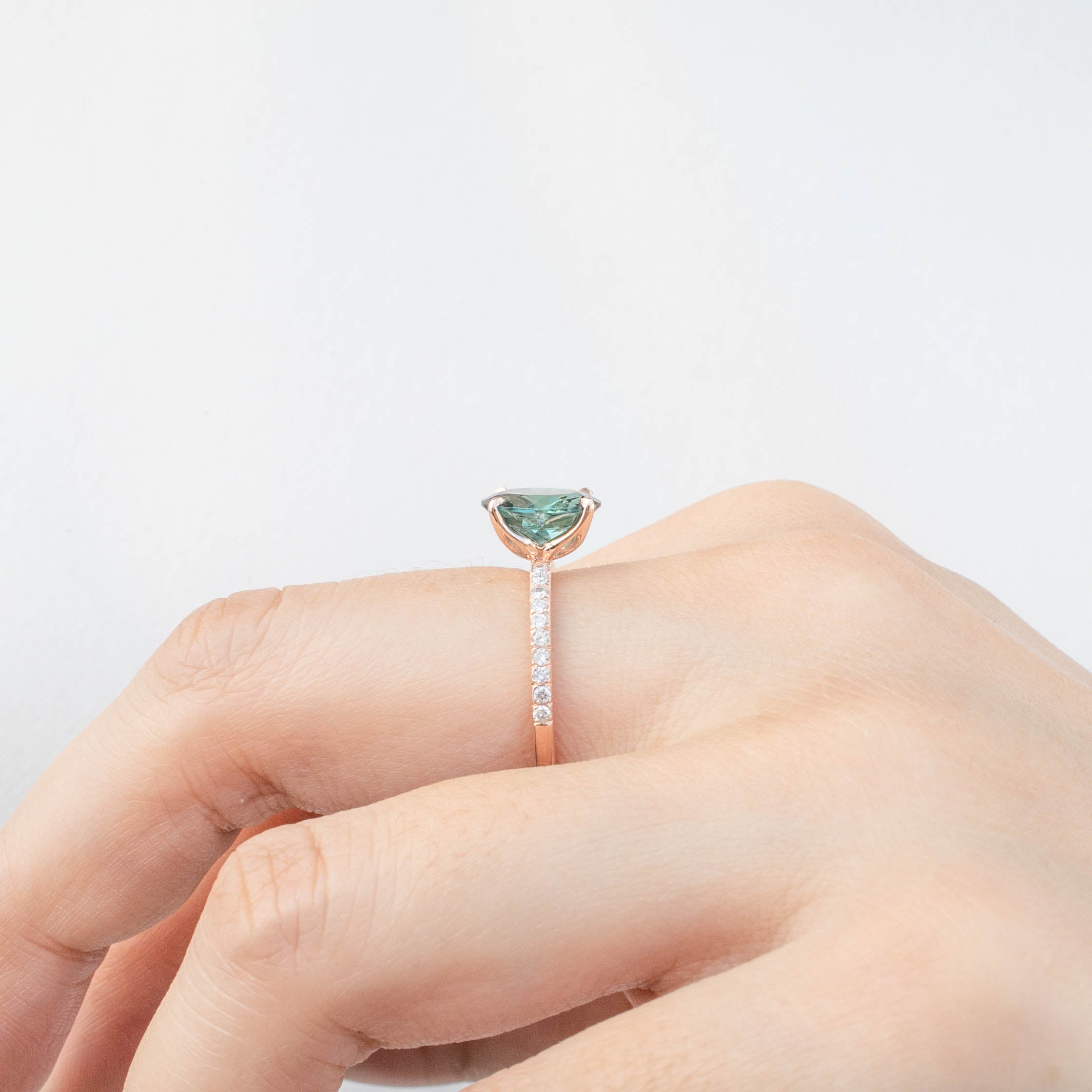 Maria Ring with 1.8ct Namibian green tourmaline, 14k rose gold, handmade and ethically sourced gemstones on a hand.