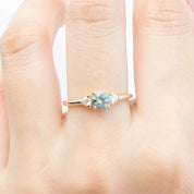 Emilie Ring with 0.66ct light blue-green Montana Sapphire and two accent diamonds in recycled 14k gold band