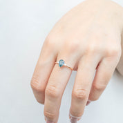 Emilie Ring featuring 1.07ct pear cut blue-green Montana sapphire set in recycled 14k rose gold band