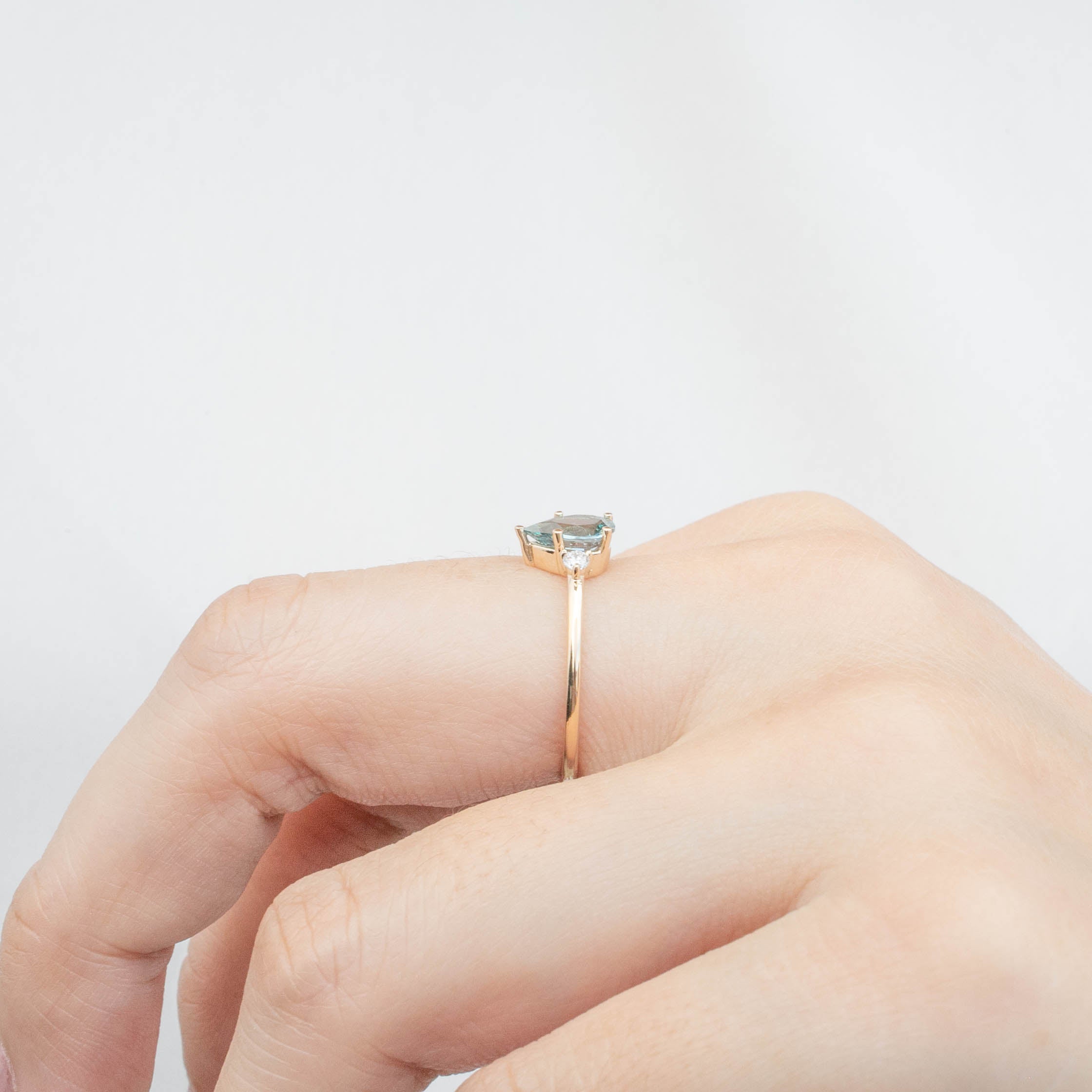 Emilie Ring featuring 0.84ct pear cut Blue Montana Sapphire on a handmade recycled 14k gold band, one of a kind design