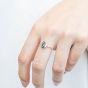 Lena Ring featuring 0.94ct marquise dark blue green sapphire, handmade with ethically sourced 14k yellow gold band