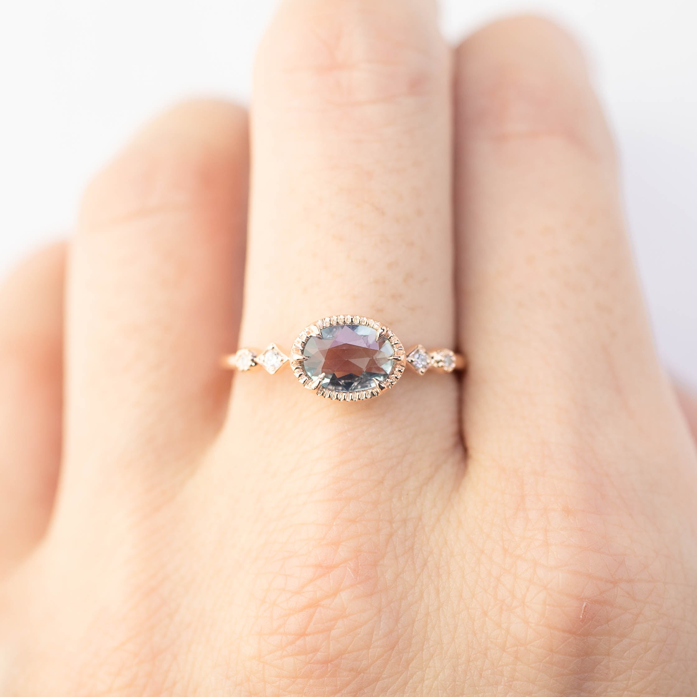 14k rose gold Stella ring with 0.8ct unheated blue sapphire and diamond accents on finger size 7