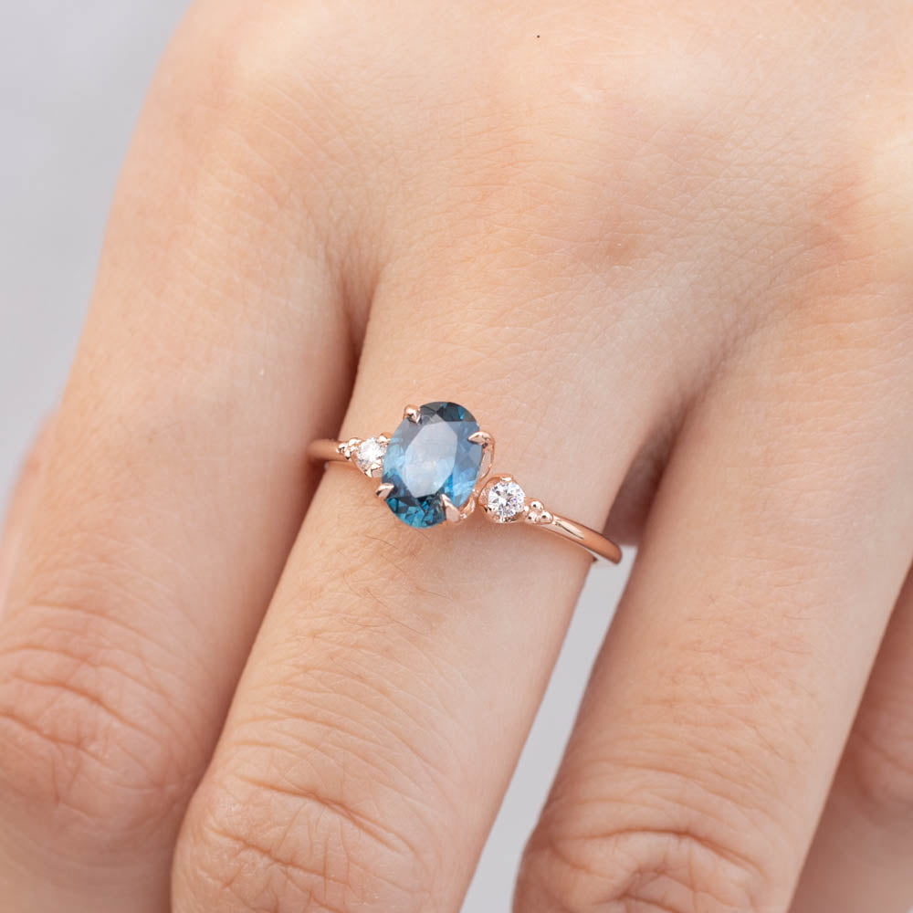Estel Ring featuring a 1.18ct teal blue Montana sapphire and diamonds in 14k rose gold, handmade and unique.