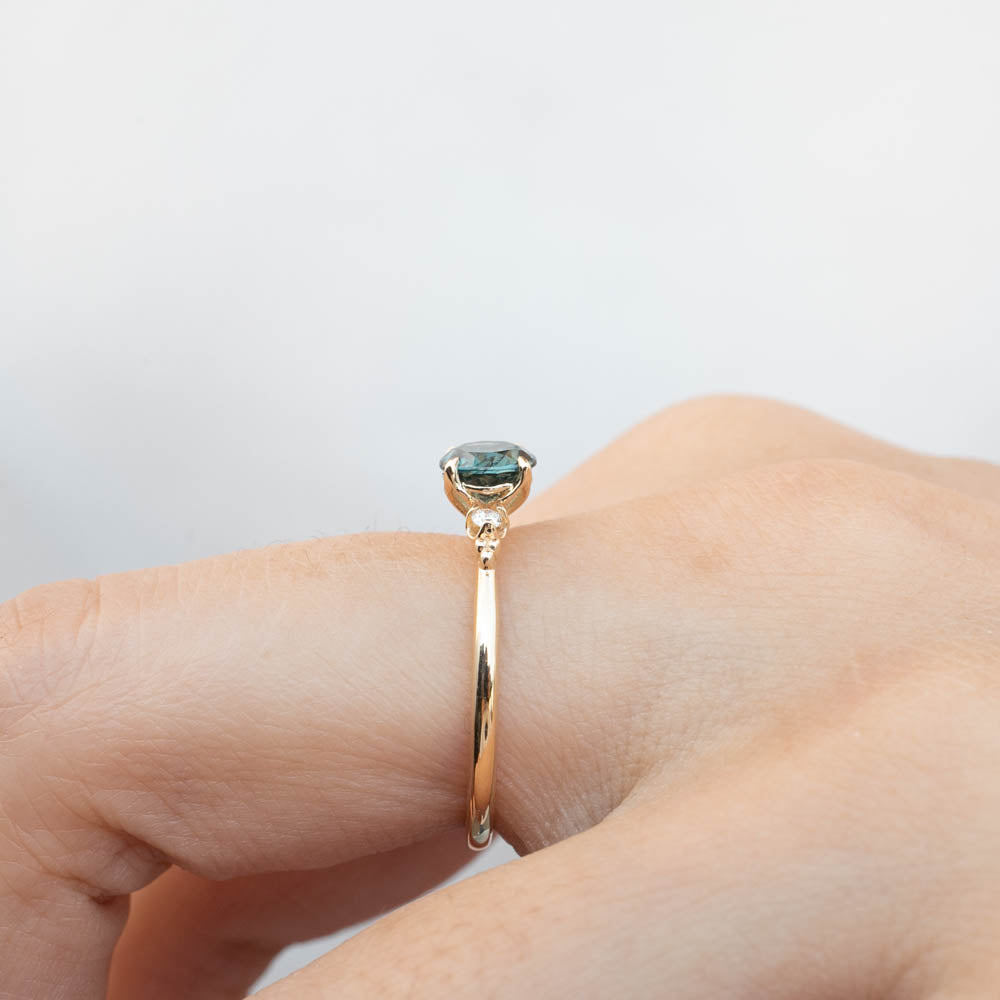 Estel Ring featuring a 0.94ct peacock green Queensland sapphire set in recycled 14k gold, one of a kind handmade design.