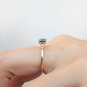 Estel Ring featuring a 0.94ct peacock green Queensland sapphire set in recycled 14k gold, one of a kind handmade design.