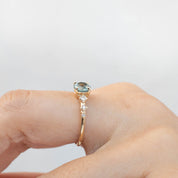 Celeste Ring with 1.1ct light green Montana sapphire and diamond accents in recycled 14k yellow gold band