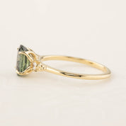 Estel Ring featuring a 1.72ct peacock green sapphire in a handmade recycled 14k gold setting with diamond accents.