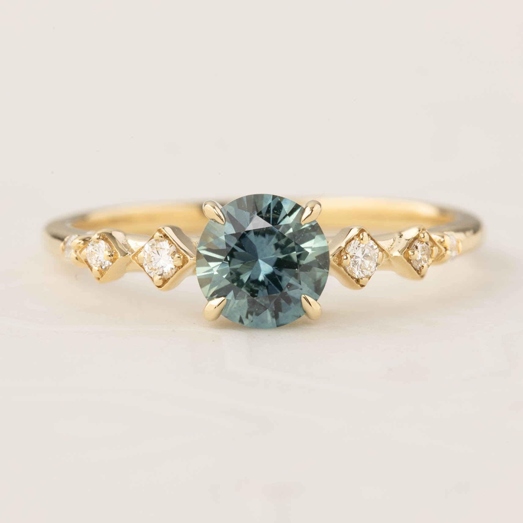 Celeste Ring featuring a 0.89ct blue green Montana Sapphire and accent diamonds in recycled 14k gold, handmade and one of a kind.