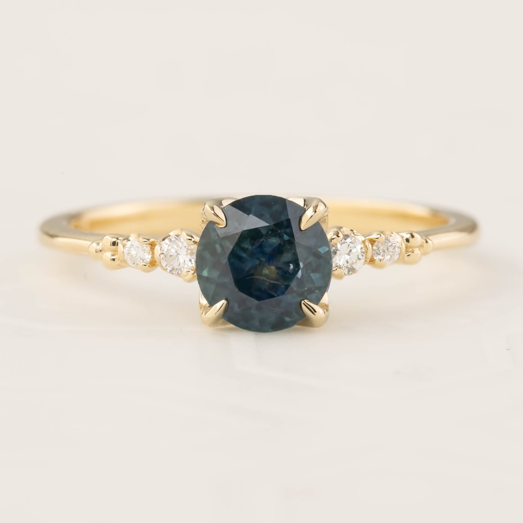 Estel Luxe Ring featuring a 1.16ct blue-green Montana sapphire and diamond accents in 14k gold band