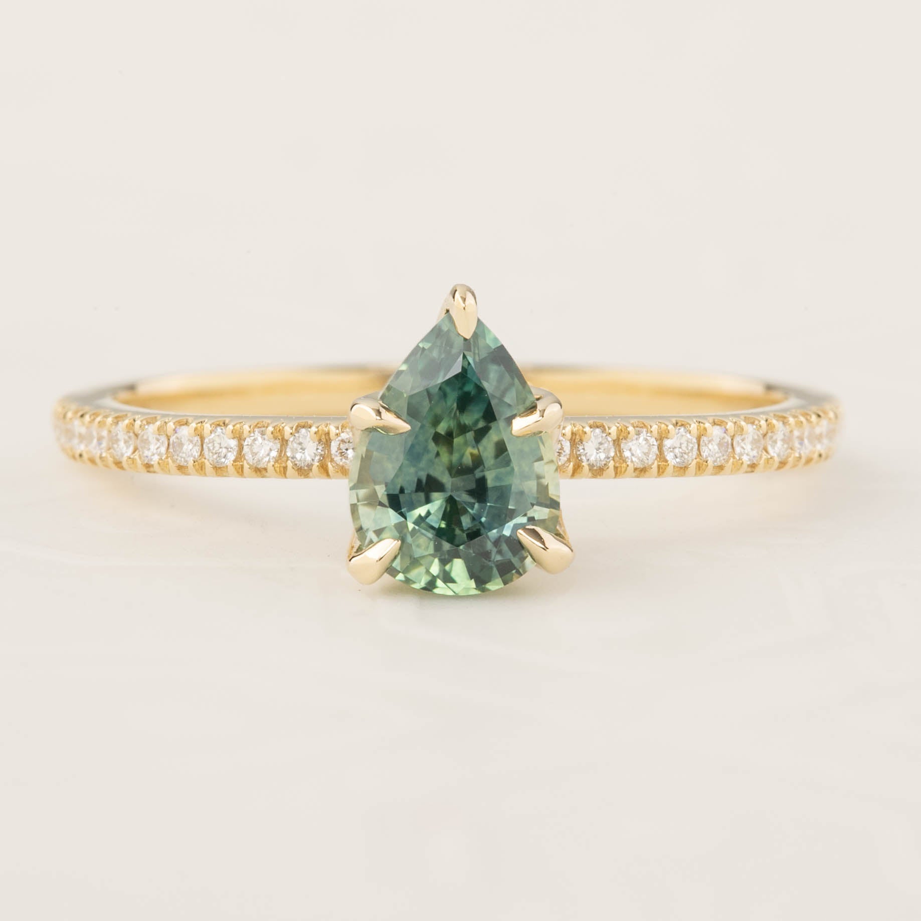 Maria Ring with 1.31ct pear cut light blue green Montana sapphire and white diamond band by Envero Jewelry, handmade design