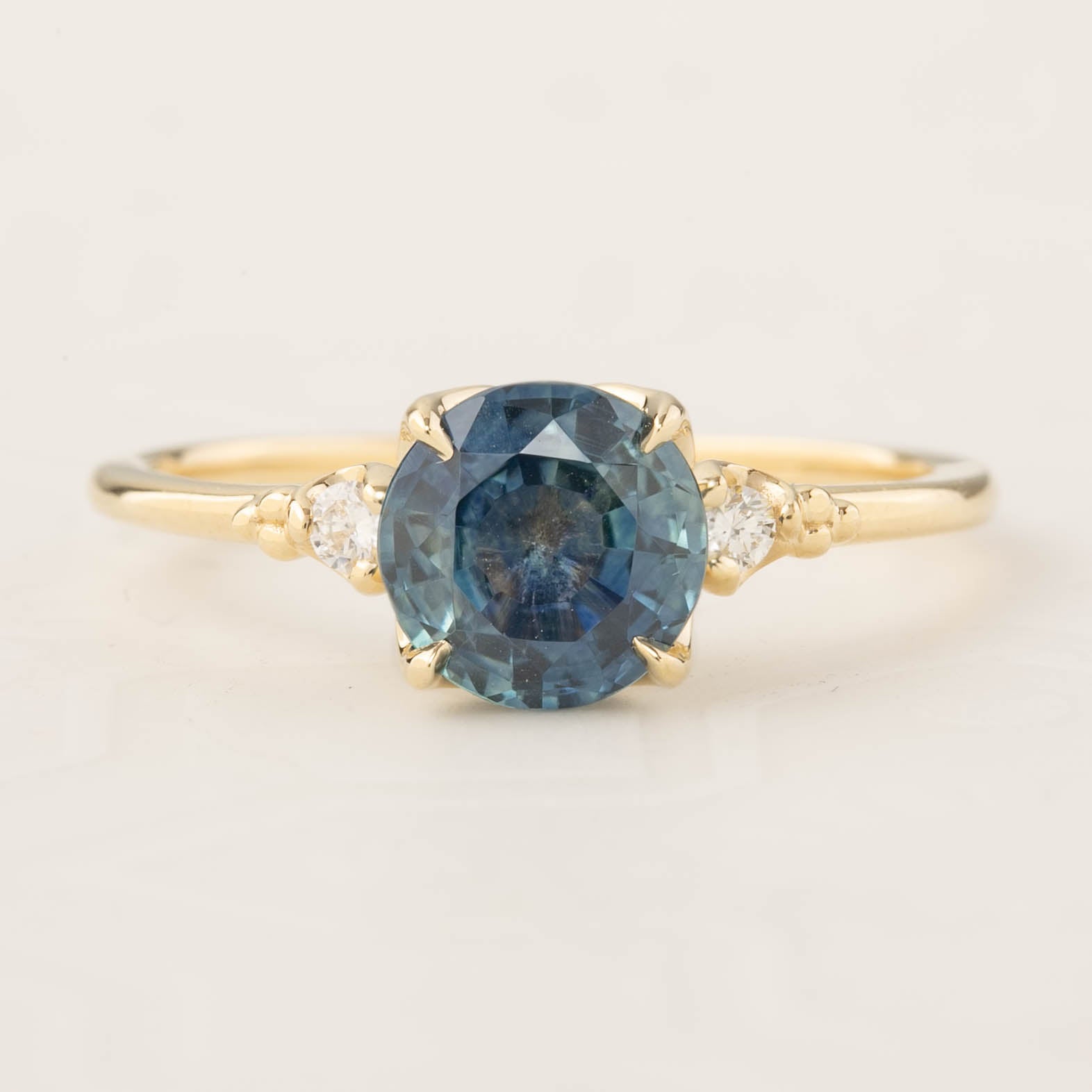 Estel Ring featuring a 1.58ct parti blue Montana sapphire with accent diamonds in 14k recycled gold, handmade and ethical.
