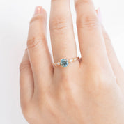 Celeste Ring with 0.89ct blue-green Montana sapphire and accent diamonds, handmade in recycled 14k yellow gold.