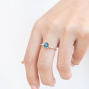 Estel Luxe Ring with 0.96ct teal blue Montana sapphire and white diamond accents in recycled 14k gold band.