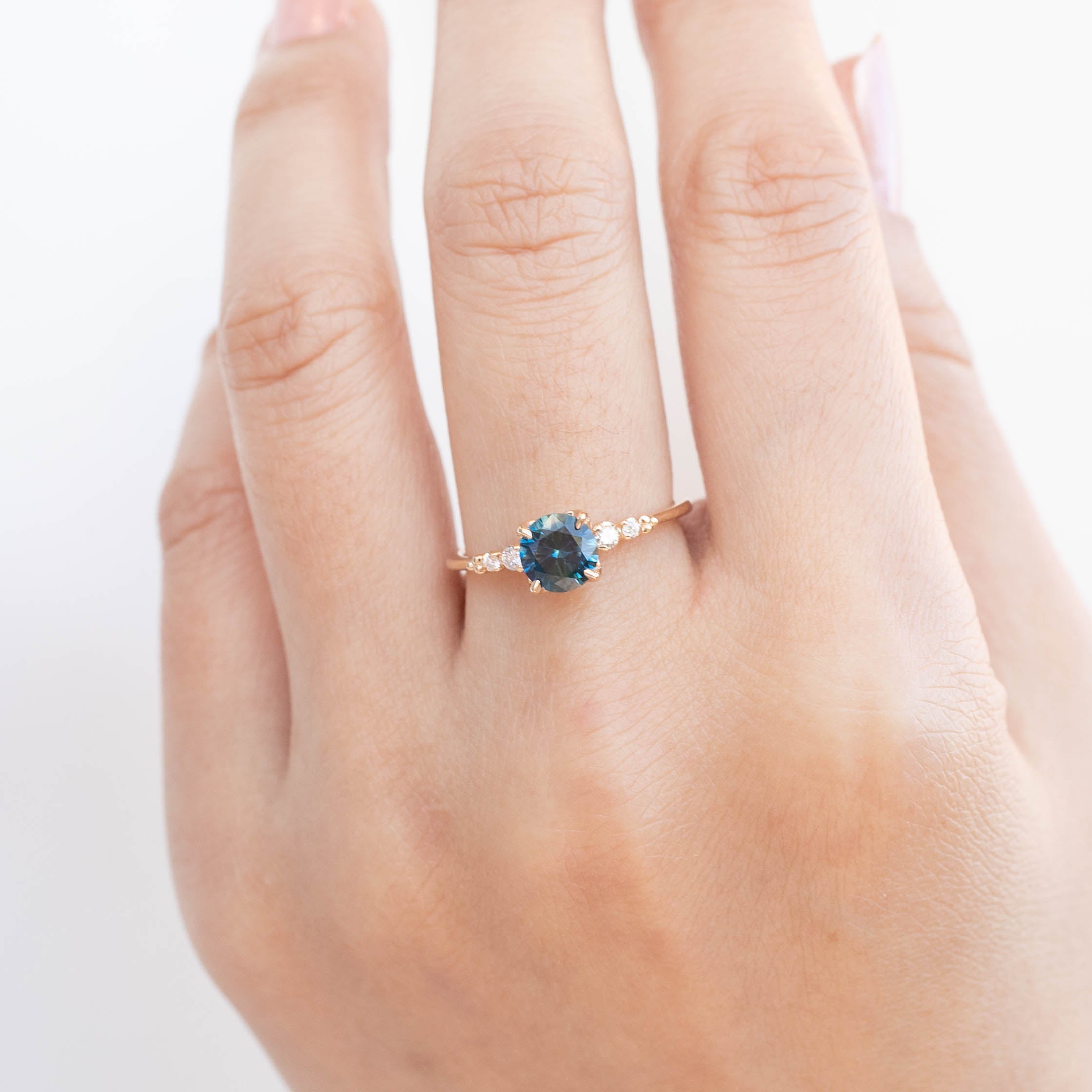 Estel Luxe Ring with 0.96ct teal blue Montana sapphire and white diamonds, handmade and ethically sourced by Envero Jewelry.