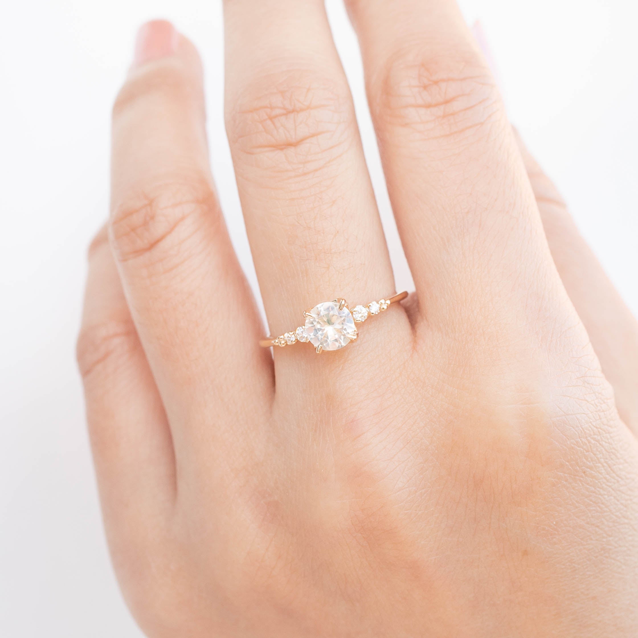 Estel Fleur Four Prongs Ring with 0.90ct white Montana sapphire, handmade, one of a kind, ethically sourced gold band.