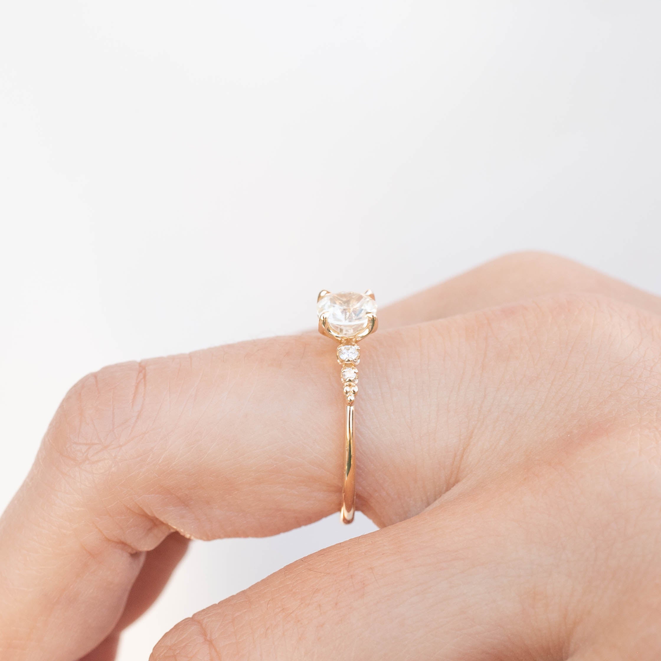 Estel Fleur Four Prongs Ring with 0.90ct white Montana sapphire, handmade, one of a kind, ethically sourced gold band.