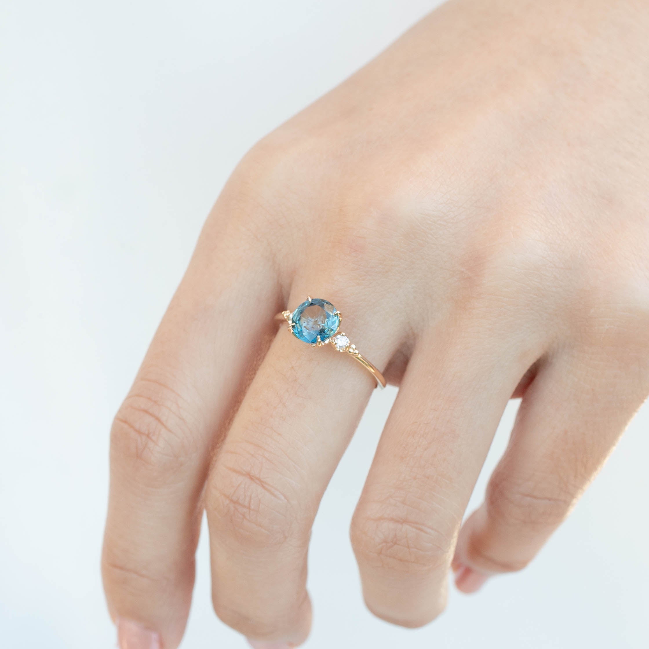 Estel Ring with 1.58ct parti blue Montana sapphire and accent diamonds in recycled 14k yellow gold, ethically sourced.