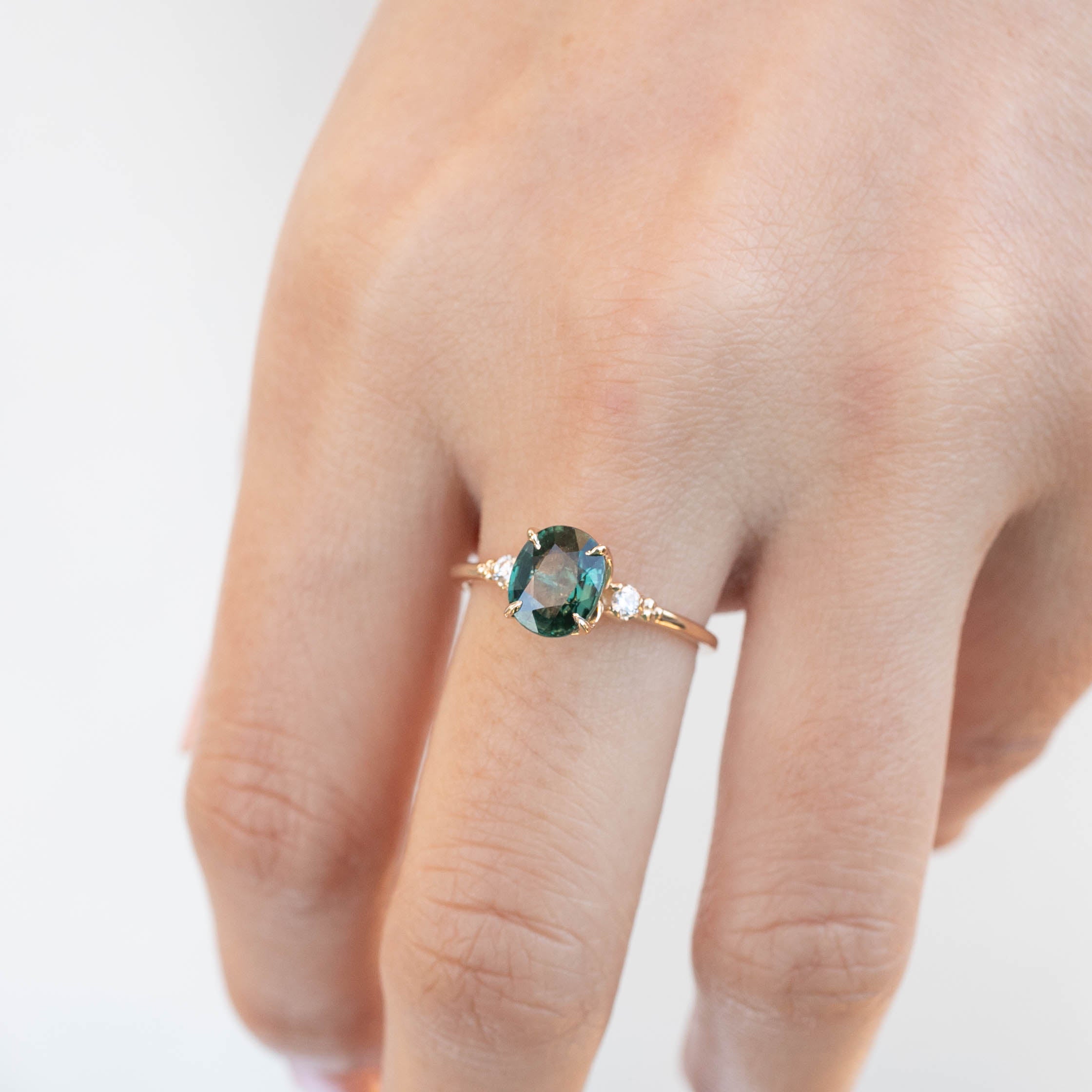 Estel Ring with 1.93ct green sapphire and white diamonds in 14k yellow gold, handmade and ethically sourced design.