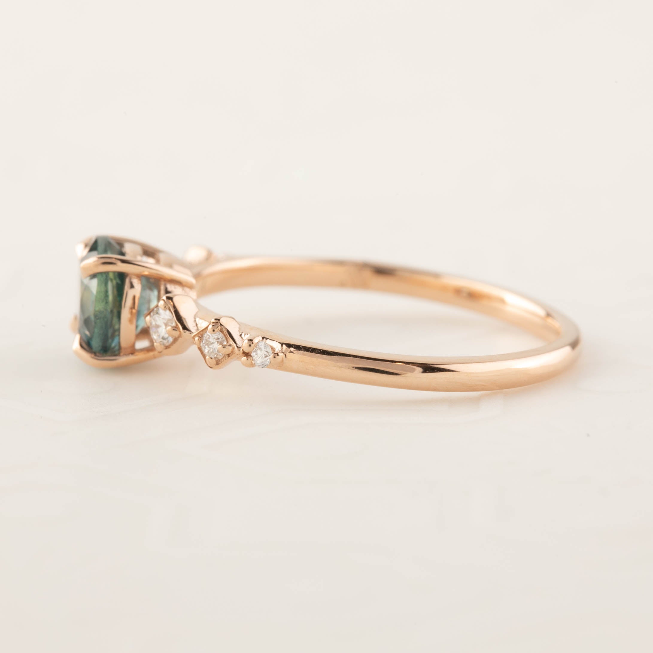 Celeste Ring with 1.19ct teal blue Montana sapphire and diamonds set in 14k rose gold, handmade and ethically sourced.