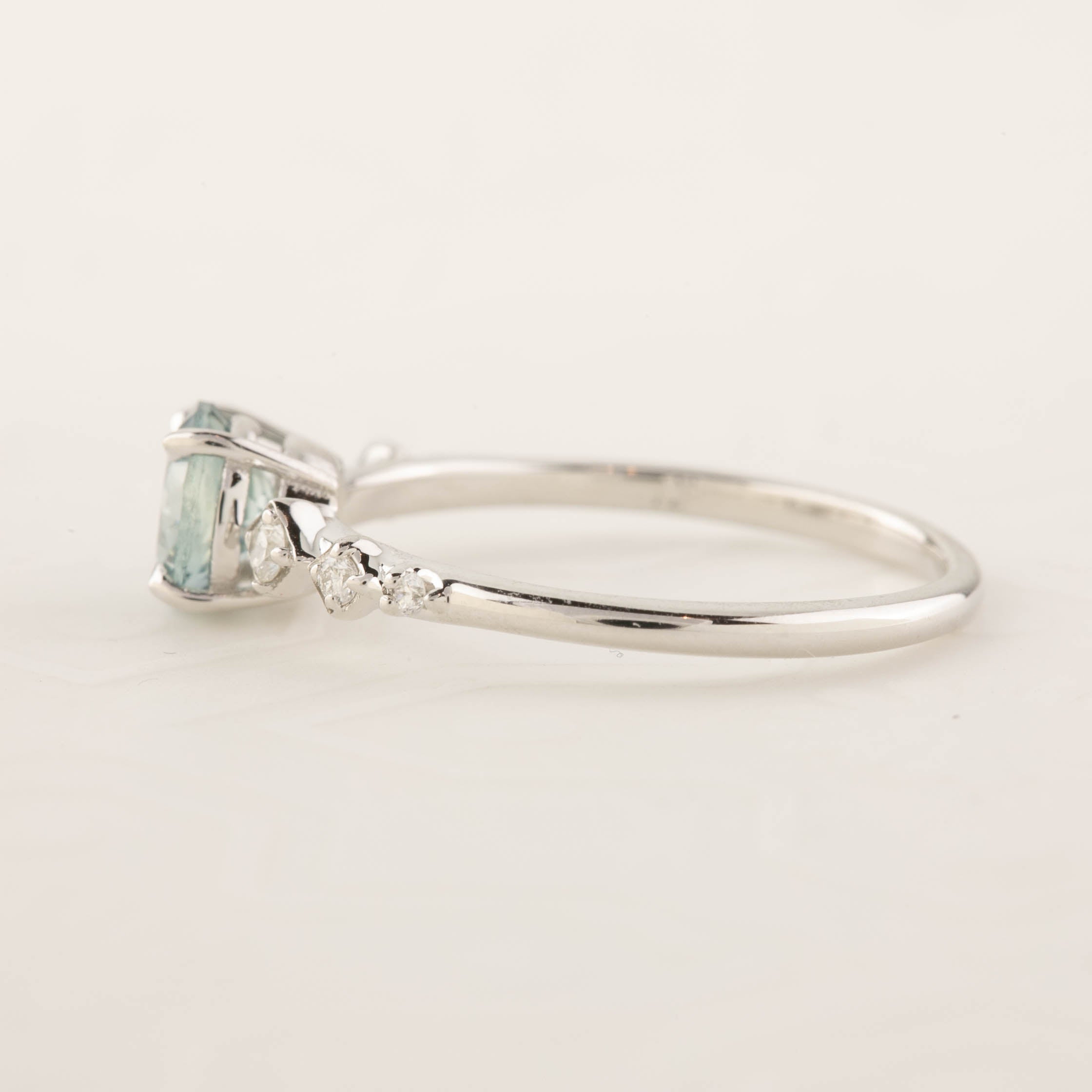 Celeste Ring featuring a 0.95ct light blue Montana sapphire with accent diamonds in 14k white gold, handmade and authentic.