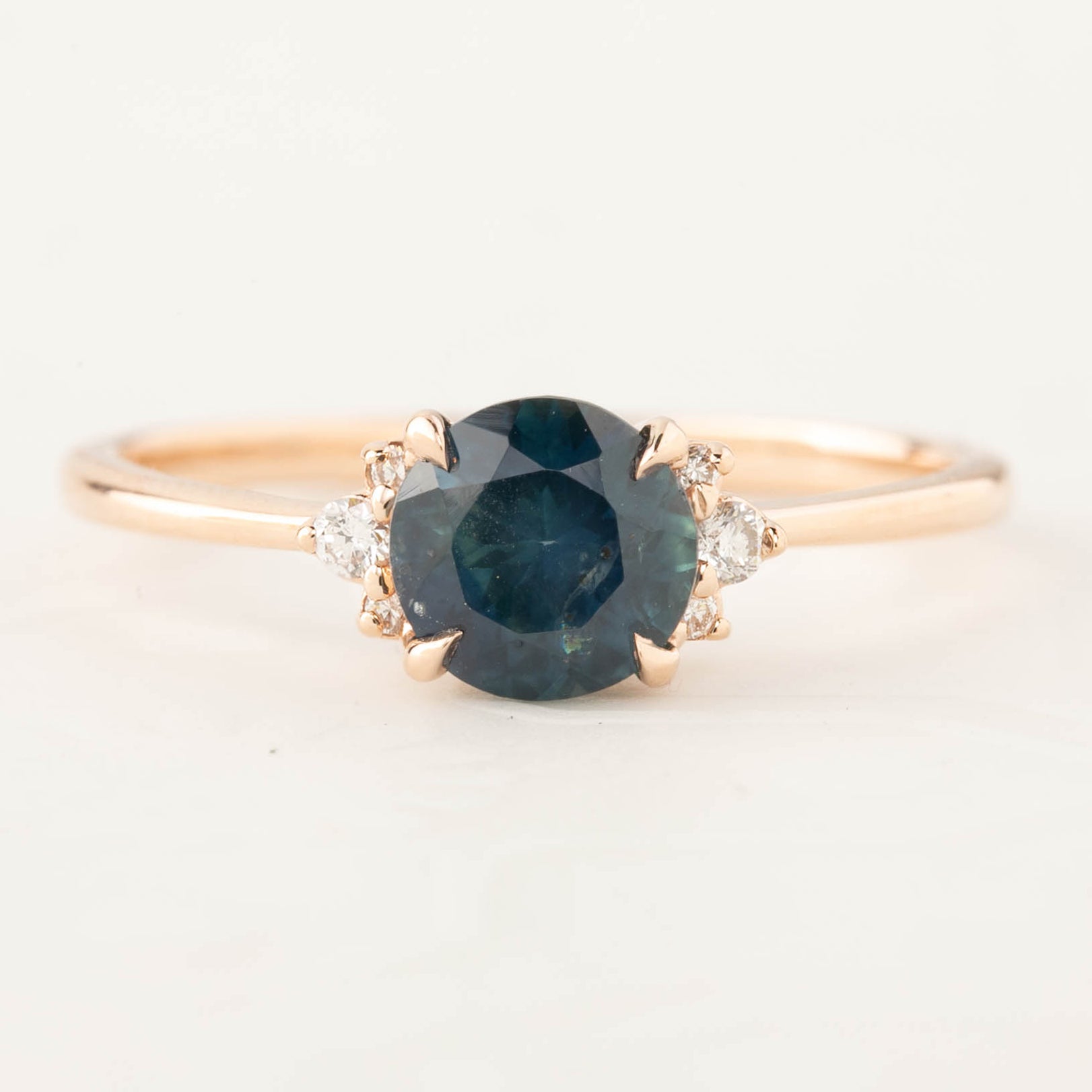 Lena Ring with 1.17ct teal Montana sapphire set in 14k rose gold, accented with white diamonds, handmade and one of a kind.