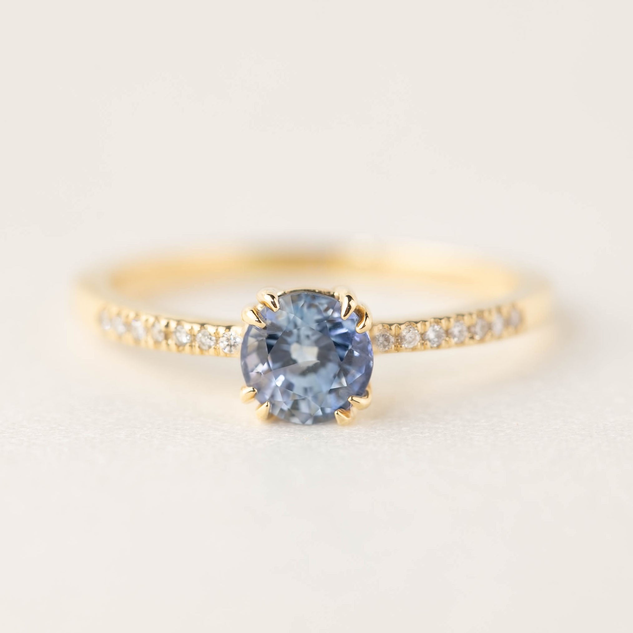 Sabrina ring with 0.88ct round Ceylon blue sapphire and diamond accents in 14k recycled gold band
