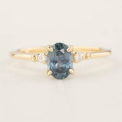 Estel Ring featuring a 1.10ct blue green Montana sapphire with diamond accents in recycled 14k gold band