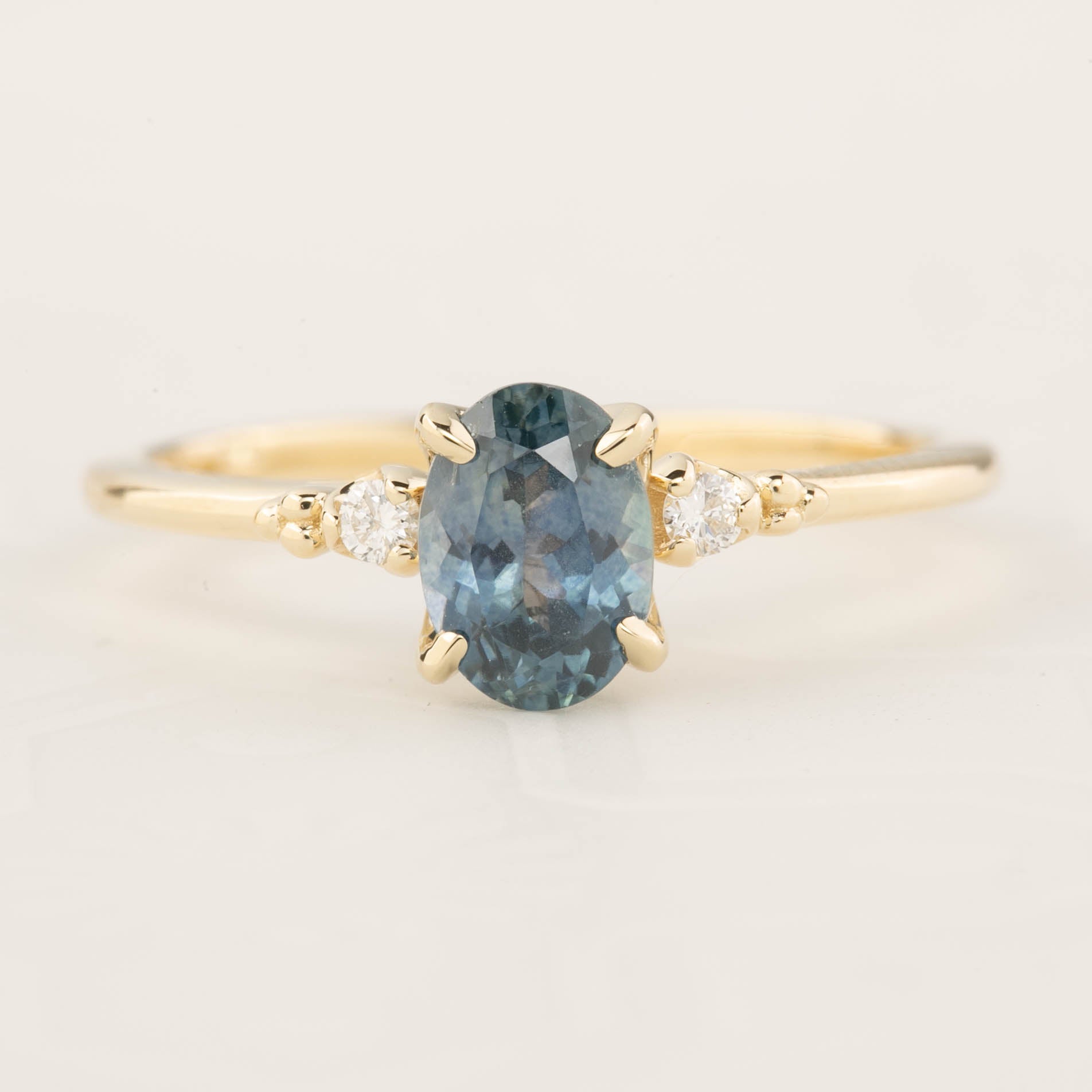 Estel Ring featuring a 1.10ct blue green Montana sapphire with diamond accents in recycled 14k gold band